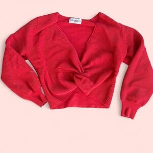 Red knit sweater with knit-esque design